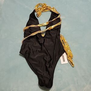 Black & Gold  one-piece bathing suit. Size small NWT